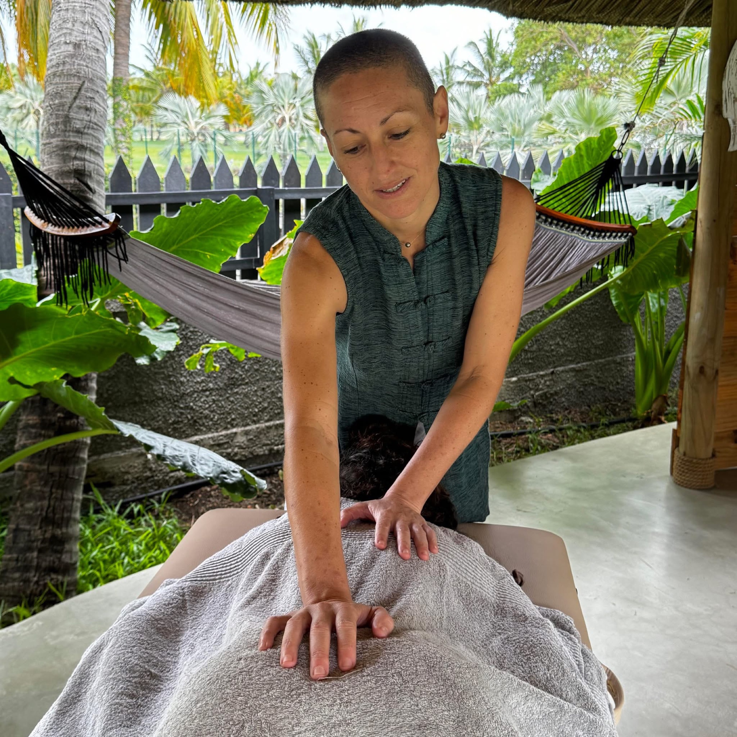 Vanessa providing a personalised massage in a peaceful tropical setting
